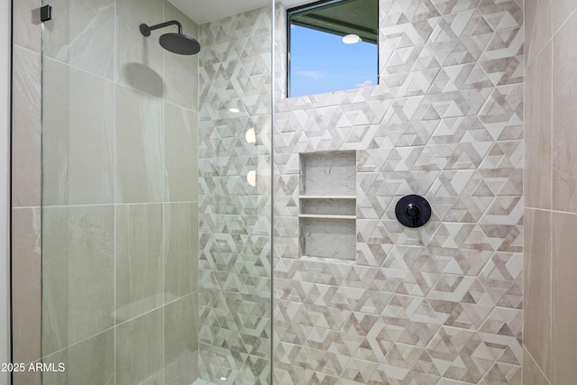 bathroom with a tile shower