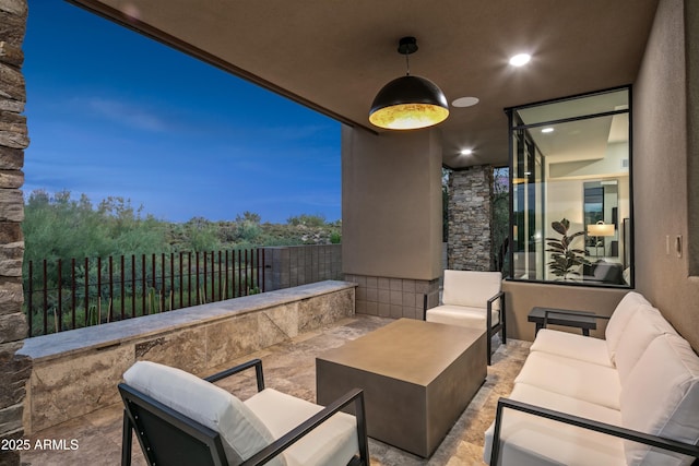 view of patio / terrace featuring fence and an outdoor living space