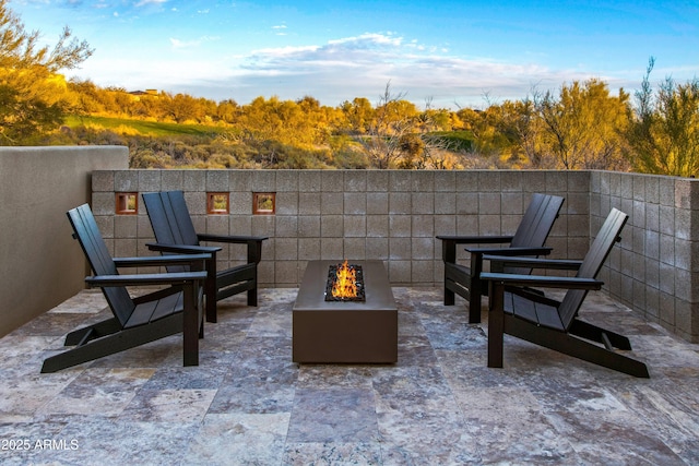 view of patio featuring an outdoor fire pit