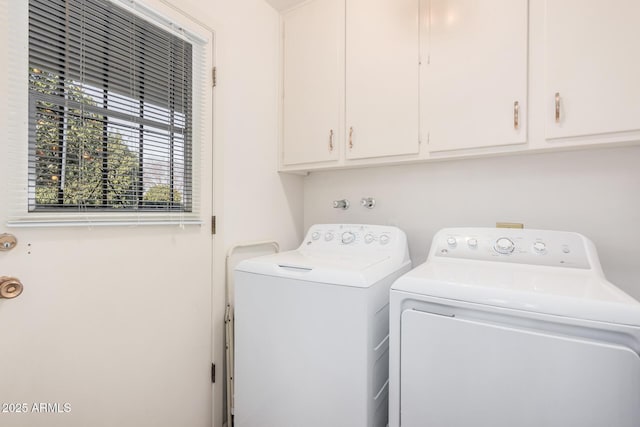 laundry area with cabinets and independent washer and dryer