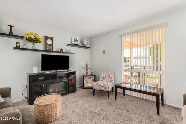 living room featuring light colored carpet and a textured ceiling