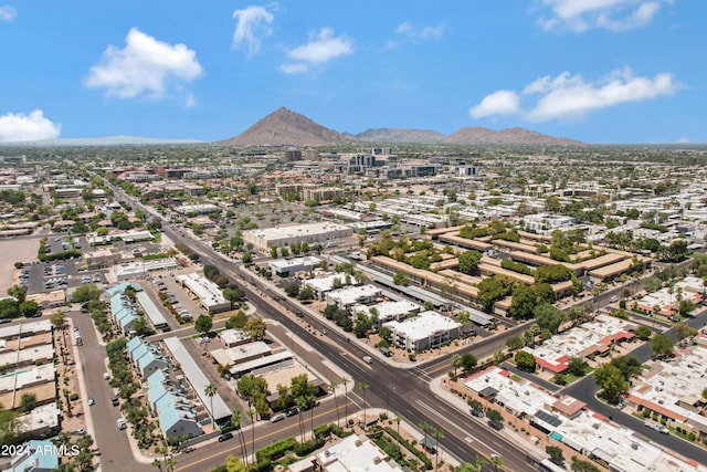 birds eye view of property with a mountain view