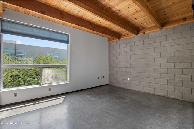 unfurnished room with beamed ceiling and wooden ceiling