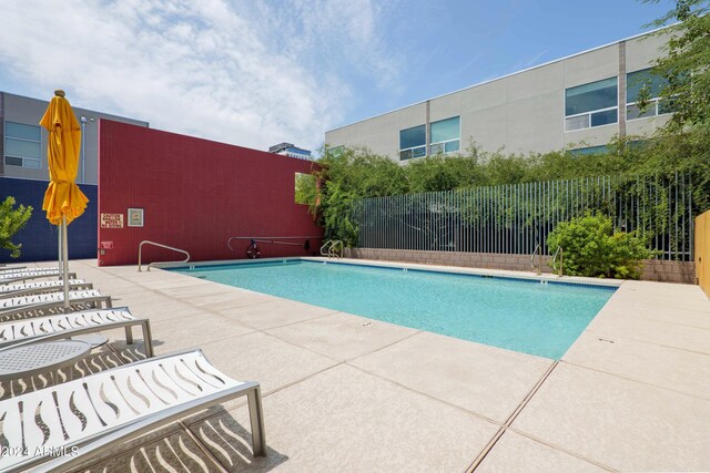 view of swimming pool with a patio