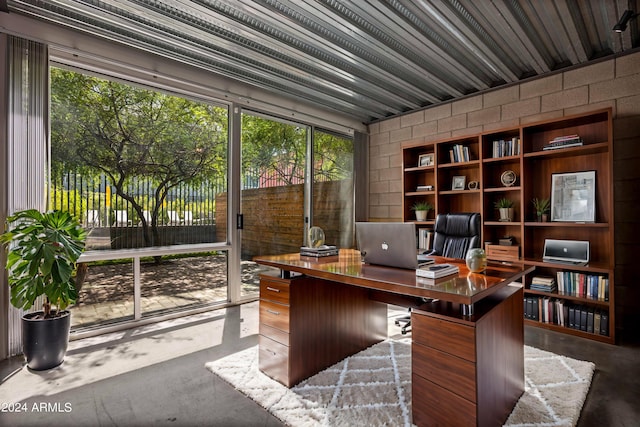 office area with concrete flooring