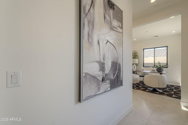corridor with recessed lighting, visible vents, and baseboards