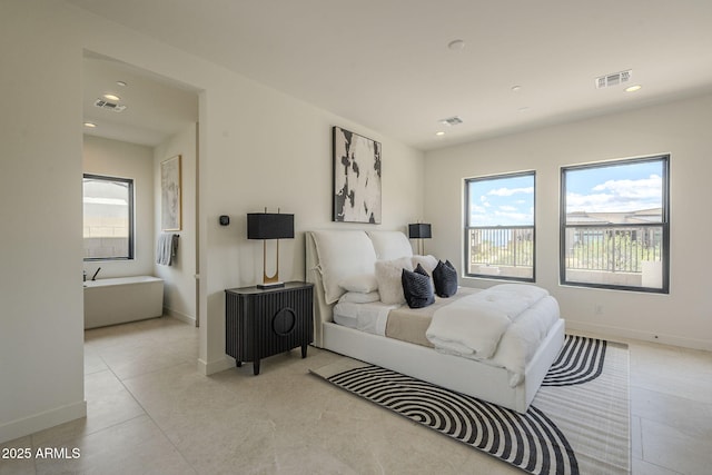 bedroom featuring visible vents, baseboards, and light tile patterned floors