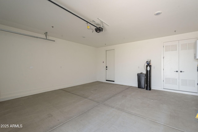 garage featuring baseboards and a garage door opener