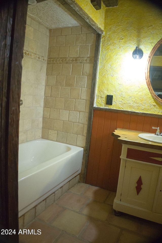 bathroom featuring vanity and a bath