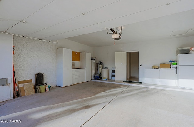 garage with freestanding refrigerator and a garage door opener