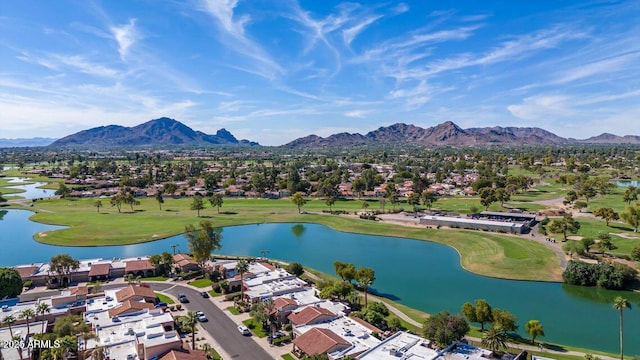 bird's eye view featuring view of golf course, a residential view, and a water and mountain view