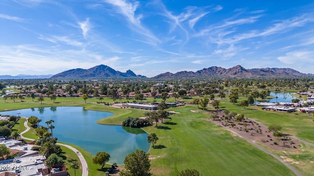 aerial view with view of golf course and a water and mountain view