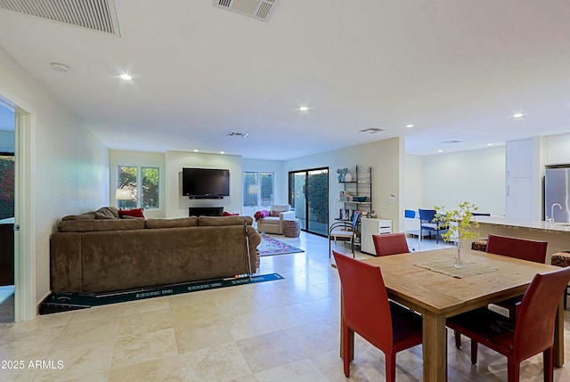 dining room featuring visible vents and recessed lighting