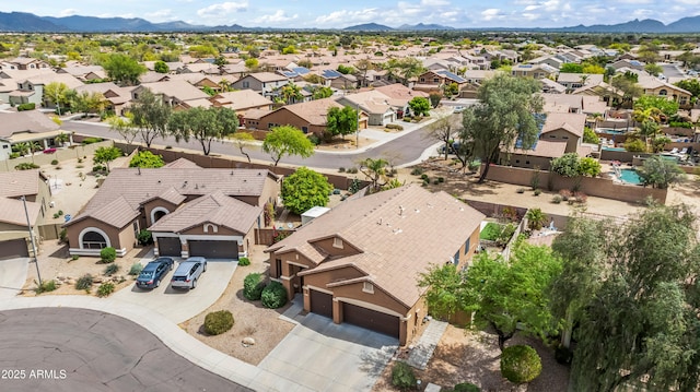 aerial view of residential area featuring a mountain backdrop