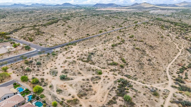 aerial view of sparsely populated area with a desert landscape and mountains