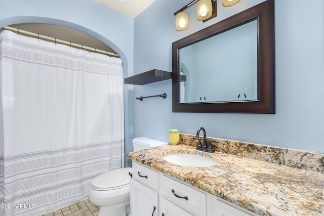 full bathroom with vanity and toilet