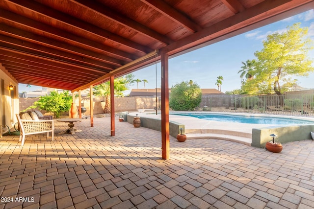 view of patio featuring a fenced backyard and a fenced in pool