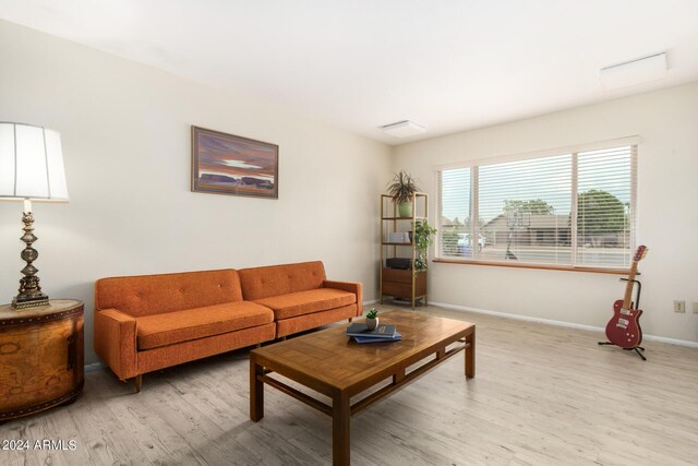 living room with light hardwood / wood-style flooring