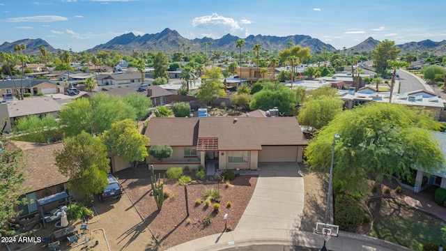 drone / aerial view featuring a residential view and a mountain view