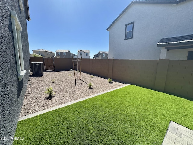 view of yard with a fenced backyard