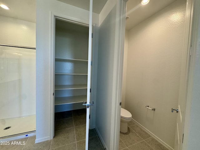 full bathroom with tile patterned floors, toilet, recessed lighting, and a shower stall