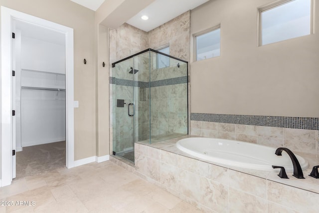 bathroom featuring separate shower and tub