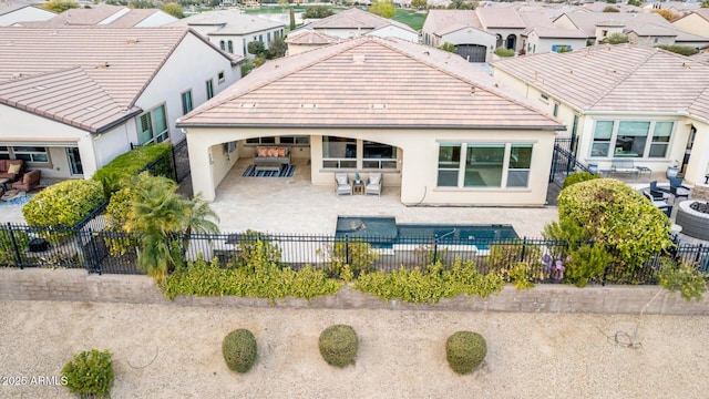 rear view of house with a patio