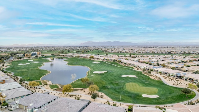 drone / aerial view with a water and mountain view