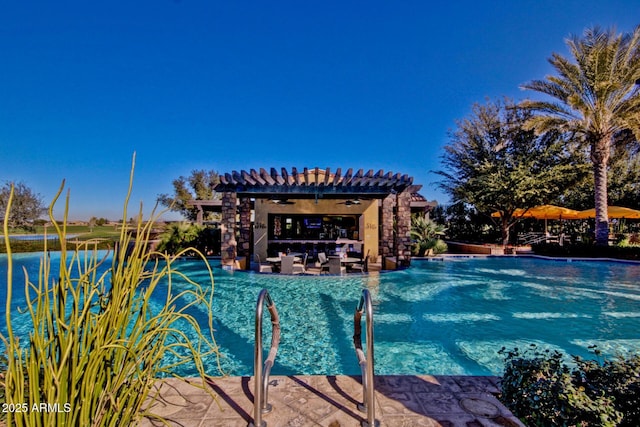 view of swimming pool featuring a pergola