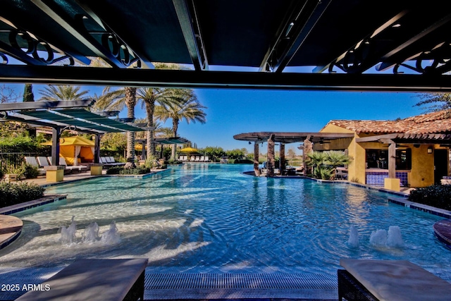 view of swimming pool featuring a pergola