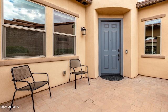 doorway to property with a patio