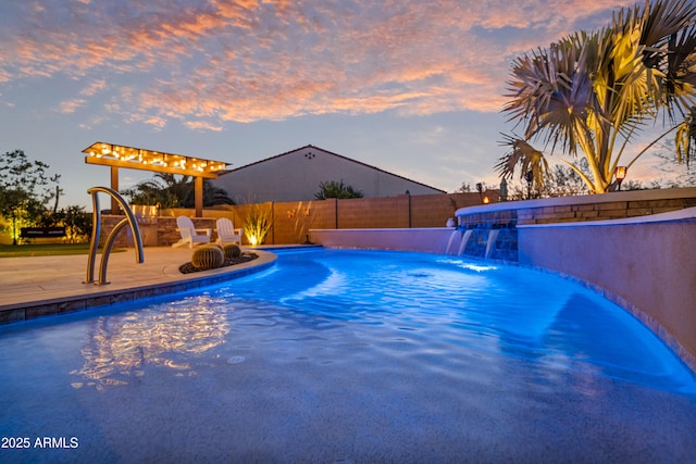 pool at dusk featuring a patio area and pool water feature