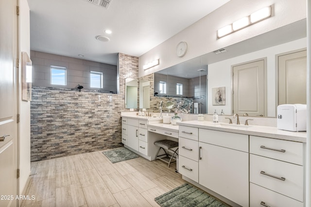 bathroom featuring vanity and walk in shower