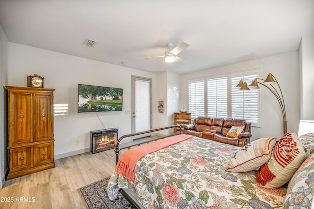 bedroom featuring ceiling fan and light hardwood / wood-style floors