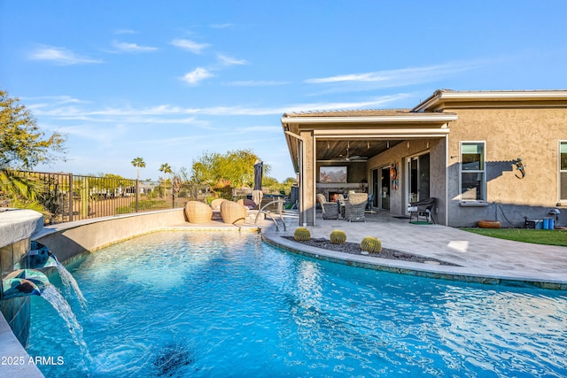 view of pool with pool water feature and a patio area