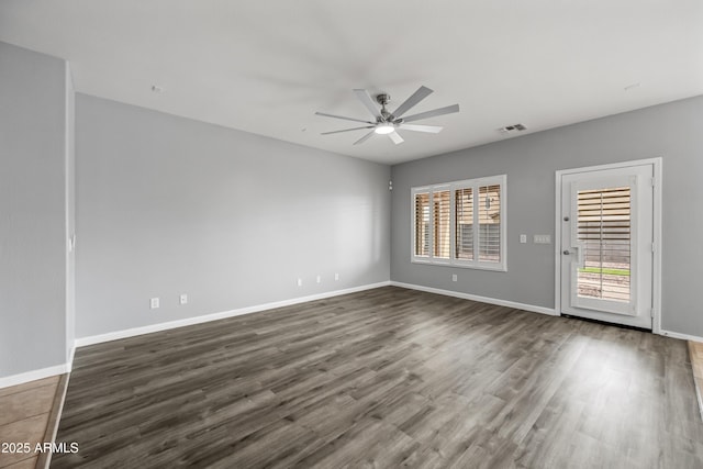16763 W Magnolia St, Goodyear, AZ 85338 - empty room with a ceiling fan, wood finished floors, and baseboards