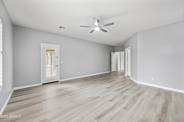 16763 W Magnolia St, Goodyear, AZ 85338 - empty room featuring a ceiling fan, wood finished floors, and baseboards
