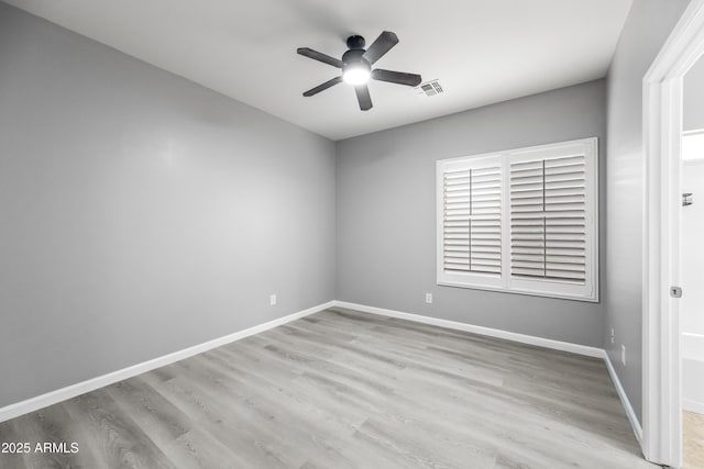 16763 W Magnolia St, Goodyear, AZ 85338 - spare room featuring ceiling fan, wood finished floors, and baseboards