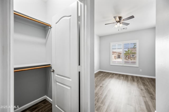 16763 W Magnolia St, Goodyear, AZ 85338 - spacious closet with wood finished floors and a ceiling fan