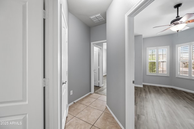 16763 W Magnolia St, Goodyear, AZ 85338 - hallway featuring baseboards and light tile patterned flooring