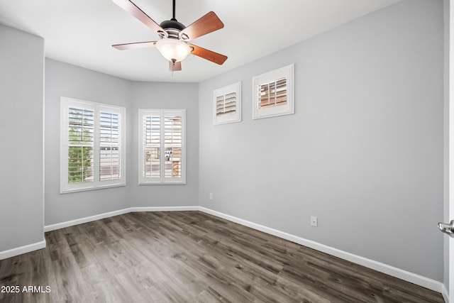 16763 W Magnolia St, Goodyear, AZ 85338 - empty room with dark wood finished floors and baseboards