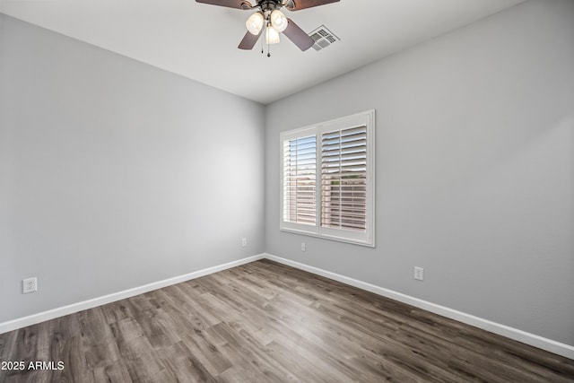 16763 W Magnolia St, Goodyear, AZ 85338 - unfurnished room with wood finished floors, a ceiling fan, and baseboards