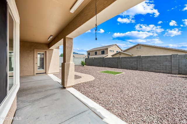 16763 W Magnolia St, Goodyear, AZ 85338 - fenced backyard featuring a patio area