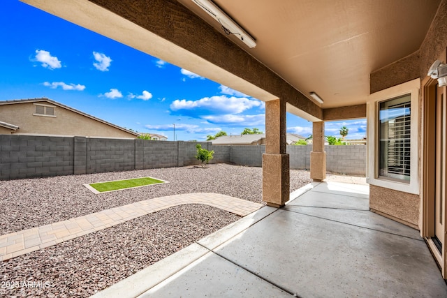 16763 W Magnolia St, Goodyear, AZ 85338 - fenced backyard with a patio area