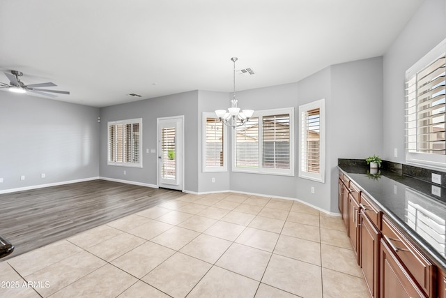 16763 W Magnolia St, Goodyear, AZ 85338 - kitchen featuring healthy amount of natural light, a chandelier, decorative light fixtures, and light tile patterned floors
