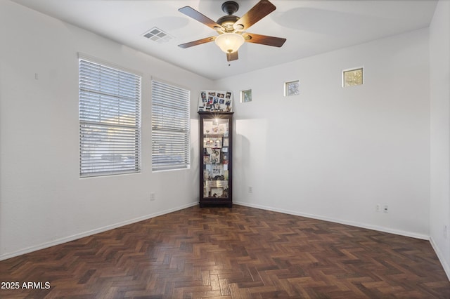 spare room with dark parquet flooring