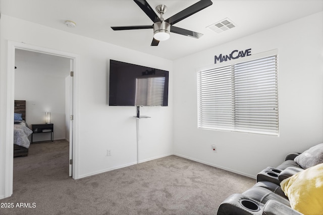 unfurnished living room with light carpet and ceiling fan