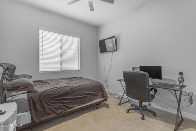 bedroom with a ceiling fan and carpet flooring
