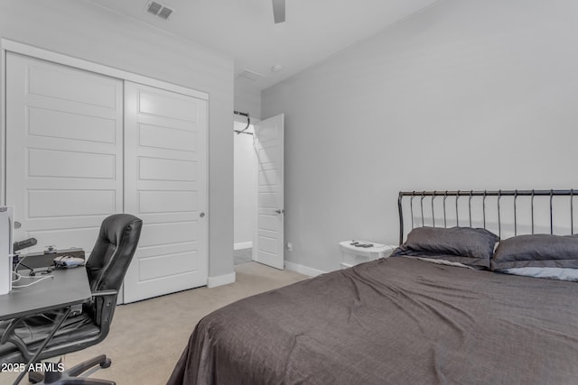 bedroom with a closet, ceiling fan, carpet, baseboards, and visible vents
