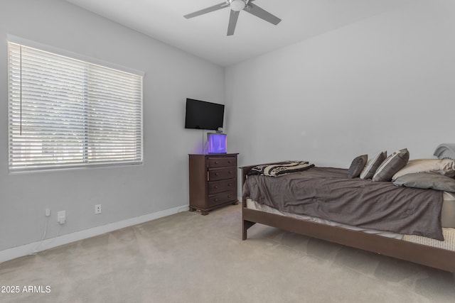 bedroom featuring carpet floors, a ceiling fan, and baseboards